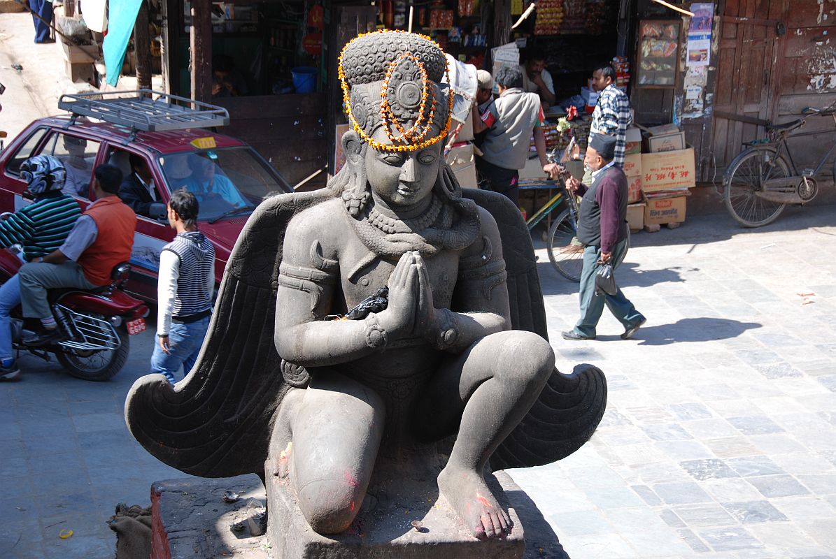 Kathmandu Durbar Square 03 01 Garuda Statue Garuda kneels with his hands in the namaste position in Kathmandu Durbar Square.